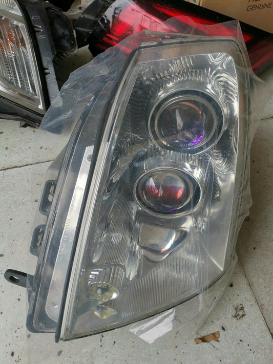 CADILLAC STS EURO HEADLIGHT LEFT OR RIGHT SIDE USED
