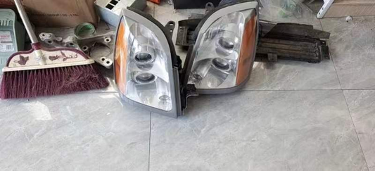 CADILLAC SRX EURO HEADLIGHT LEFT OR RIGHT SIDE USED